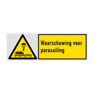 Veiligheidsbord met pictogram en tekst Waarschuwing voor parasailing